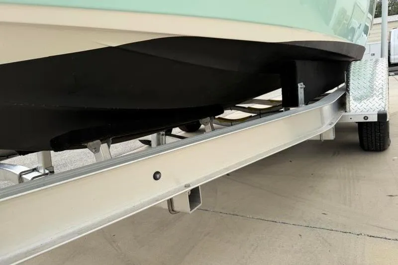 Slide: The Image of 2024 Key West 203 FS boat on trailer, close-up of hull and support structure. - 43