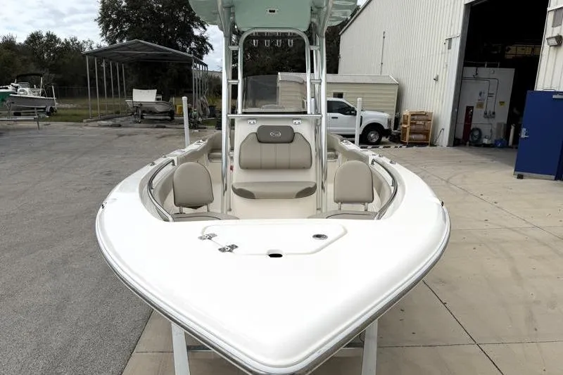 Slide: The Image of 2024 Key West 203 FS boat at a marina, showcasing sleek design and seating. - 6