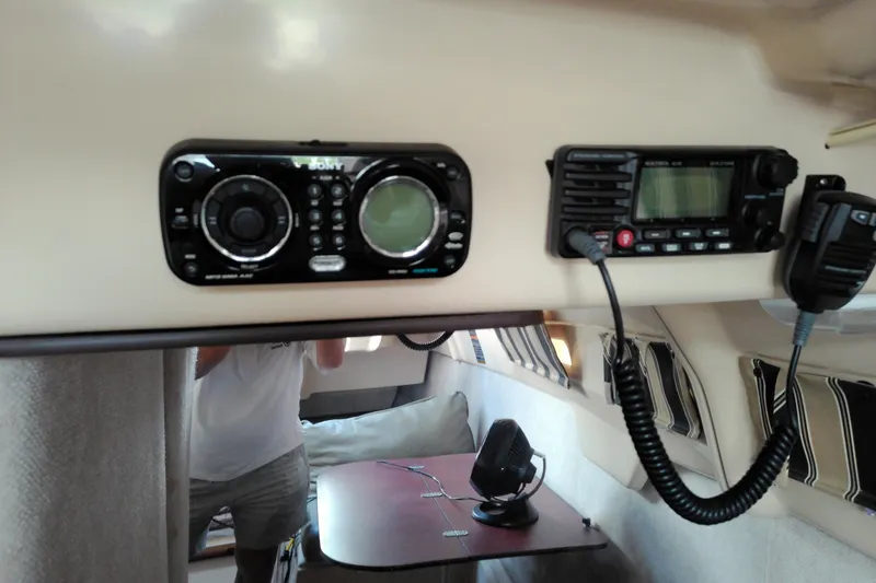 Slide: The Image of Interior of 2011 MacGregor 26M sailboat with radio and control panel. - 22