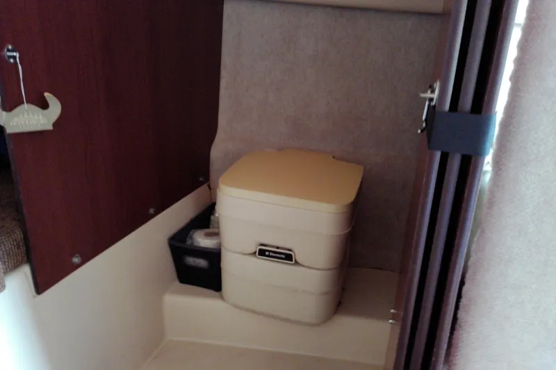 Slide: The Image of Compact bathroom in 2011 MacGregor 26M sailboat with portable toilet. - 24