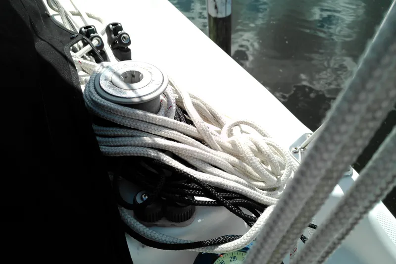 Slide: The Image of Close-up of sailing ropes on a 2011 MacGregor 26M boat deck. - 36
