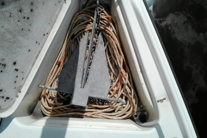 Slide: The Image of Anchor and rope storage on 2011 MacGregor 26M sailboat. - 7