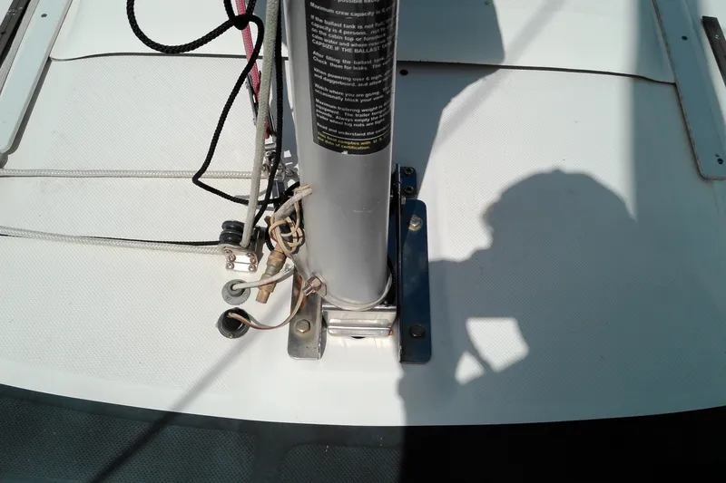 Slide: The Image of Mast base of 2011 MacGregor 26M sailboat with rigging and shadow. - 8