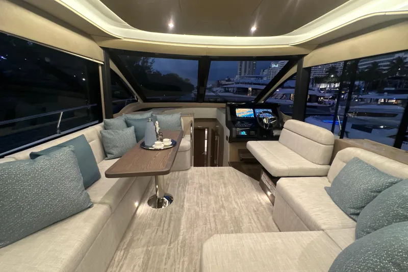Slide: The Image of Luxurious interior of 2026 Cruisers Yachts 50 Fly with elegant seating and helm. - 10