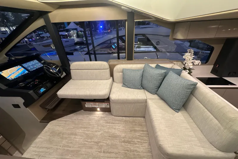 Slide: The Image of Luxurious interior of 2026 Cruisers Yachts 50 Fly with modern helm and plush seating. - 11