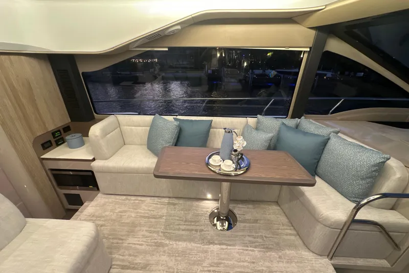 Slide: The Image of Luxurious interior of 2026 Cruisers Yachts 50 Fly with elegant seating and decor. - 13