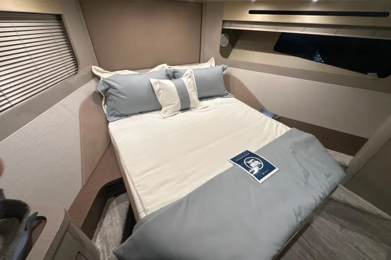 Slide: The Image of Luxurious bedroom interior of 2026 Cruisers Yachts 50 Fly with elegant bedding. - 20