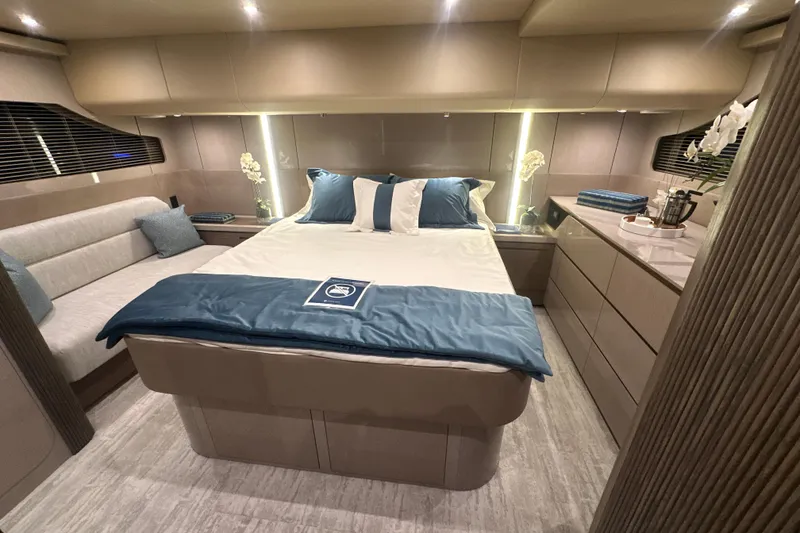 Slide: The Image of Luxurious bedroom interior of 2026 Cruisers Yachts 50 Fly, featuring elegant design and modern amenities. - 24