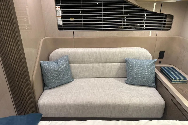 Slide: The Image of Luxurious interior of 2026 Cruisers Yachts 50 Fly with elegant sofa and cushions. - 27