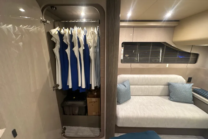 Slide: The Image of Luxurious interior of 2026 Cruisers Yachts 50 Fly with closet and seating area. - 28