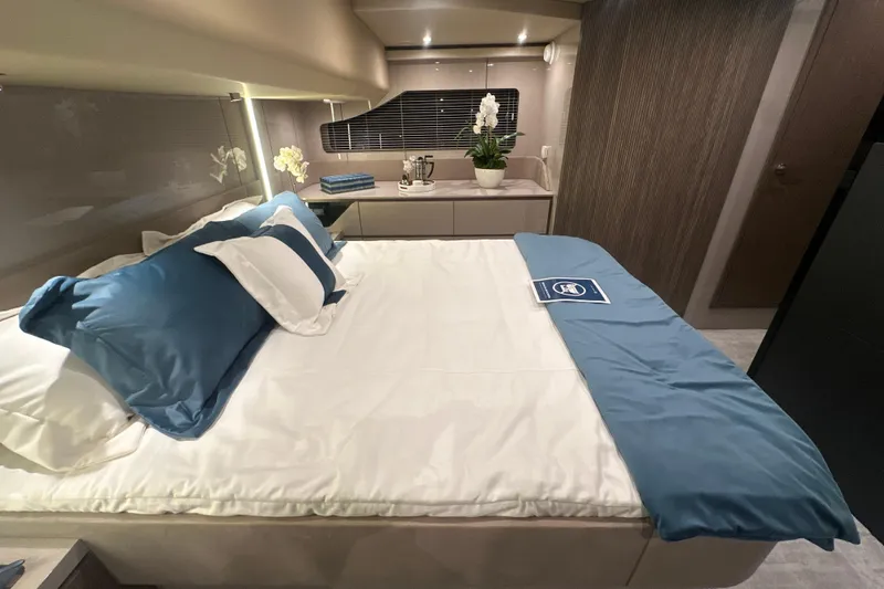 Slide: The Image of Luxurious bedroom interior of 2026 Cruisers Yachts 50 Fly with elegant bedding and decor. - 29