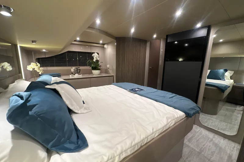 Slide: The Image of Luxurious bedroom interior of 2026 Cruisers Yachts 50 Fly, featuring elegant decor and modern amenities. - 31