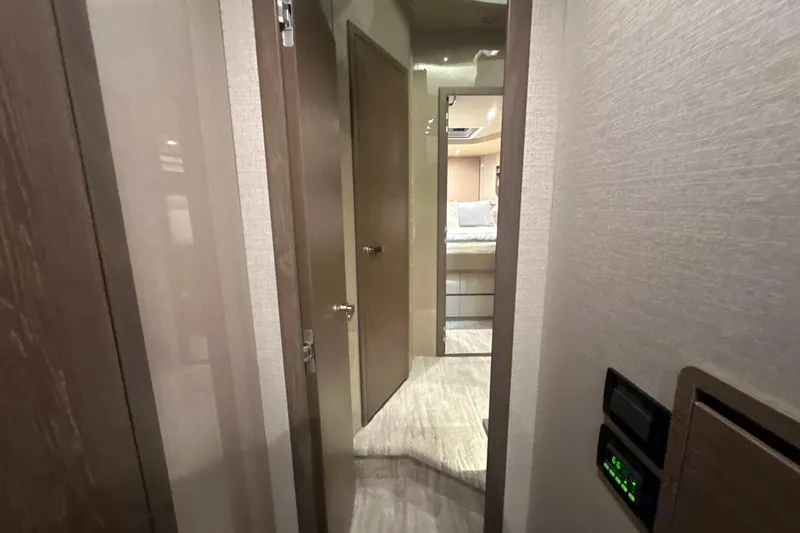Slide: The Image of Interior hallway of 2026 Cruisers Yachts 50 Fly, featuring modern design and cozy bedroom. - 34
