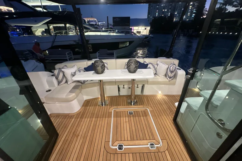 Slide: The Image of Luxurious 2026 Cruisers Yachts 50 Fly interior with elegant seating and table setup. - 39