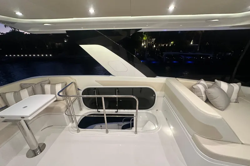 Slide: The Image of Luxurious 2026 Cruisers Yachts 50 Fly deck with elegant seating and ambient lighting. - 52