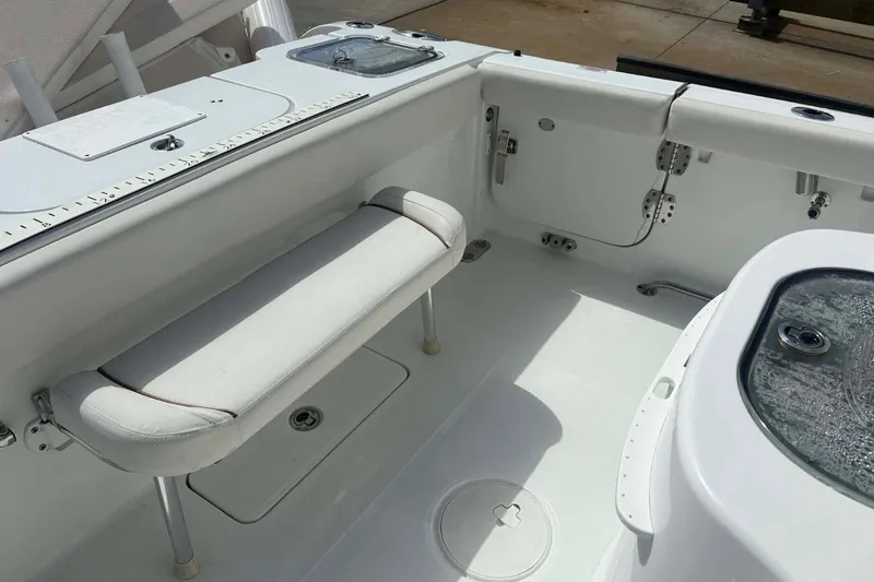Slide: The Image of 2021 Sea Hunt boat interior with cushioned seating and storage compartments. - 5