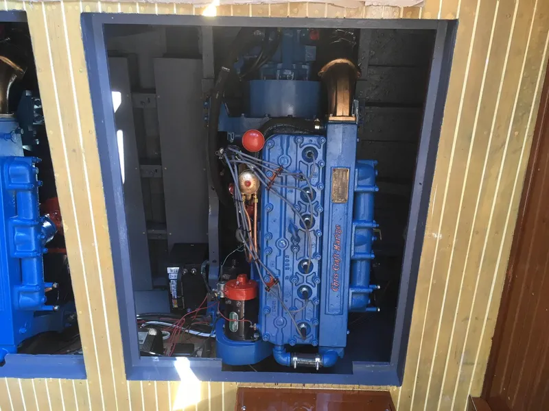 Slide: The Image of 1956 Chris-Craft Captain engine, blue, in wooden compartment. - 11