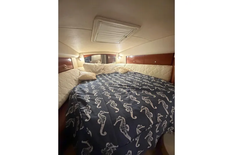 Slide: The Image of Luxurious cabin interior of 2005 Sea Ray Sundancer 320 with seahorse-patterned bedding. - 10
