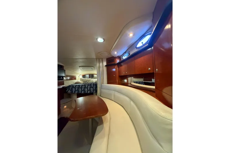 Slide: The Image of Luxurious interior of 2005 Sea Ray Sundancer 320 yacht with elegant seating and wood finishes. - 15