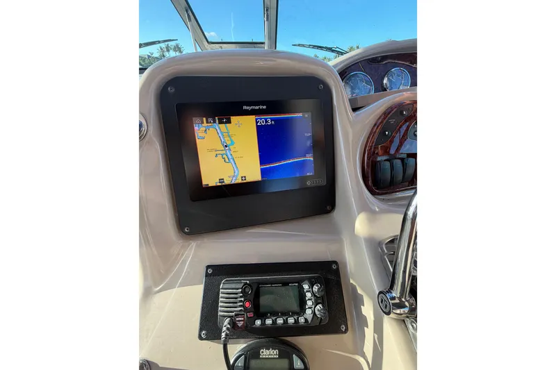 Slide: The Image of Dashboard of 2005 Sea Ray Sundancer 320 with navigation and communication systems. - 19