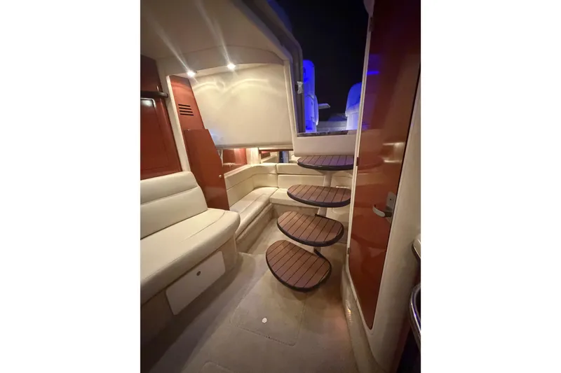 Slide: The Image of 2005 Sea Ray Sundancer 320 cruising on a sunny day, showcasing sleek design and spacious deck. - 3