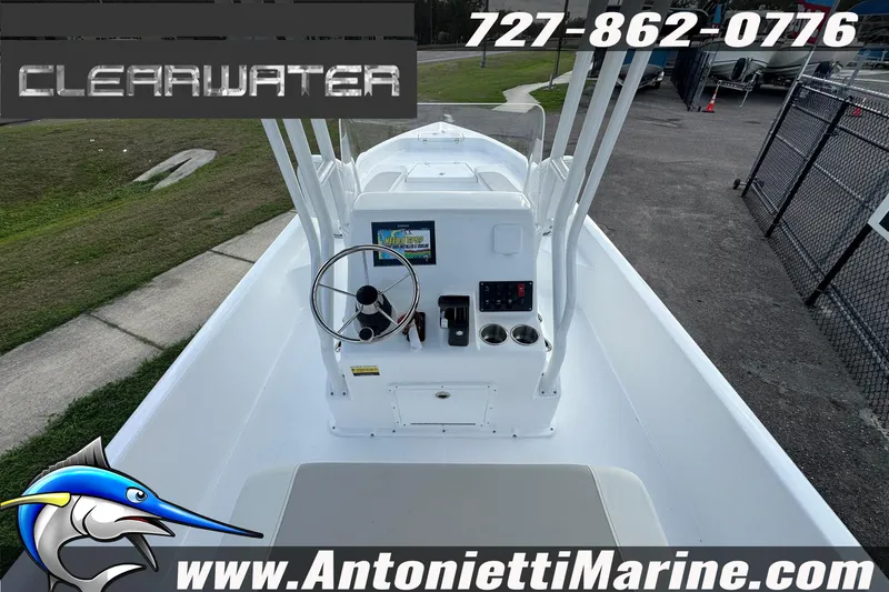 Slide: The Image of 2026 Clearwater 2100 Bay boat dashboard with steering wheel and controls, Antonietti Marine branding. - 13