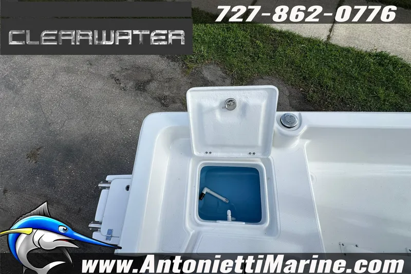 Slide: The Image of 2026 Clearwater 2100 Bay boat with open storage compartment, displayed by Antonietti Marine. - 22