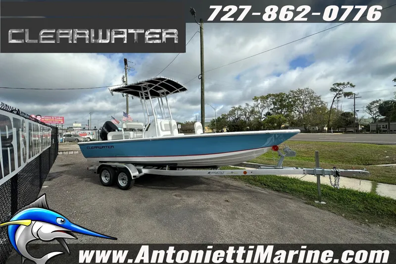 Slide: The Image of 2026 Clearwater 2100 Bay boat on trailer at Antonietti Marine dealership. - 9
