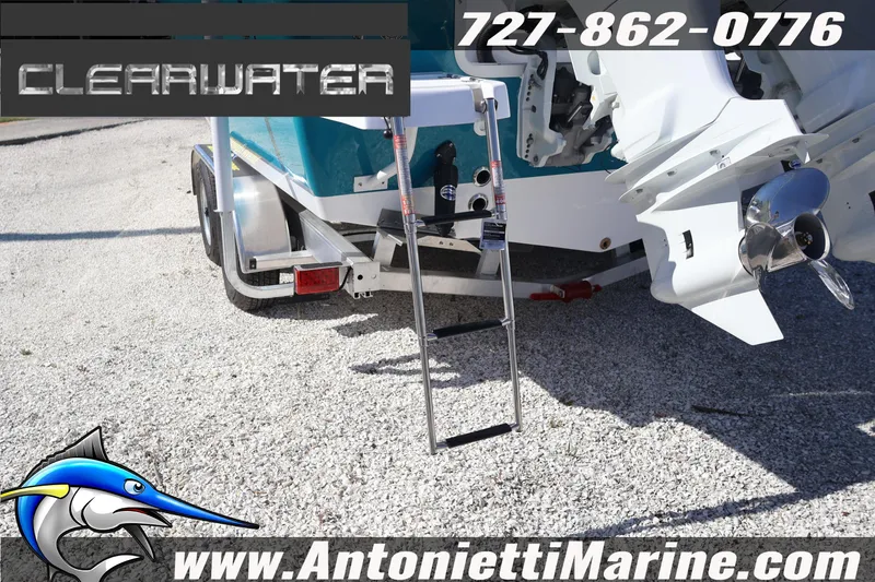 Slide: The Image of Clearwater 2300 boat on trailer, featuring outboard motor and ladder, 2026 model. - 20