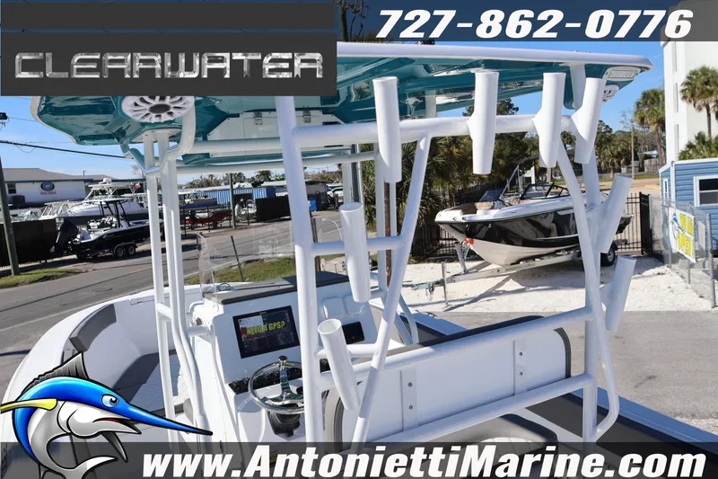 Slide: The Image of 2026 Clearwater 2300 boat at Antonietti Marine dealership, featuring rod holders and GPS system. - 21