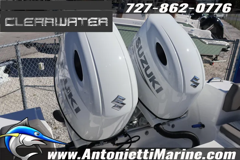 Slide: The Image of Twin Suzuki outboard motors on a Clearwater 2300 boat, 2026 model, at Antonietti Marine. - 32