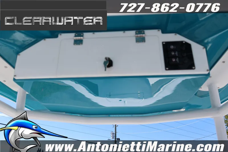 Slide: The Image of 2026 Clearwater 2300 boat console with blue finish, featuring contact details and logo. - 27