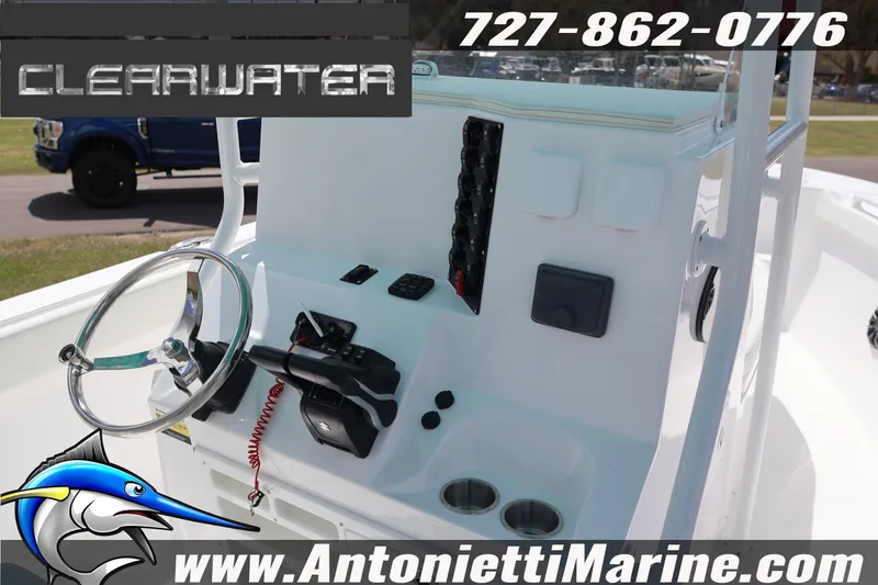 Slide: The Image of 2026 Clearwater 2800 CC boat console with steering wheel and controls, Antonietti Marine branding. - 16
