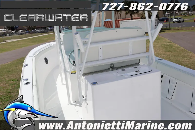 Slide: The Image of Clearwater 2800 CC 2026 boat interior with seating, contact info, and website details. - 9