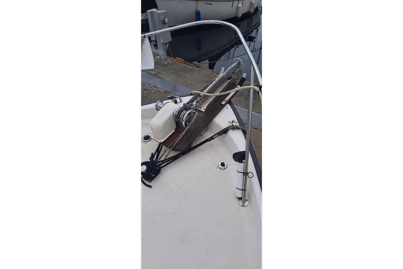 Slide: The Image of 1979 Mainship 34 Sedan boat deck with anchor and railing. - 4