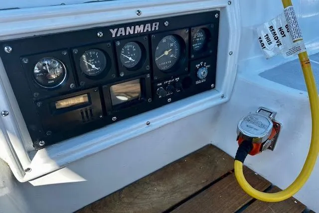 Slide: The Image of Control panel of a 1986 Hunter Passage 450 sailboat with Yanmar engine gauges. - 14