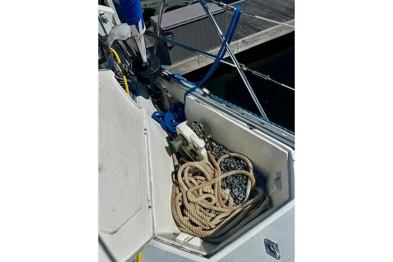 Slide: The Image of Anchor locker of 1986 Hunter Passage 450 sailboat with ropes and chains. - 17