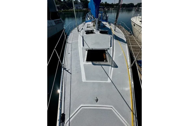 Slide: The Image of 1986 Hunter Passage 450 sailboat deck view, docked in a marina. - 18