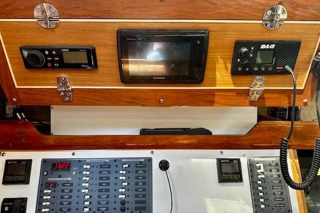 Slide: The Image of Control panel of 1986 Hunter Passage 450 sailboat with navigation and communication equipment. - 27