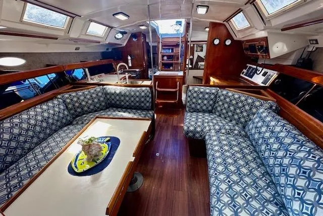 Slide: The Image of Interior of 1986 Hunter Passage 450 yacht with patterned seating and wooden accents. - 33