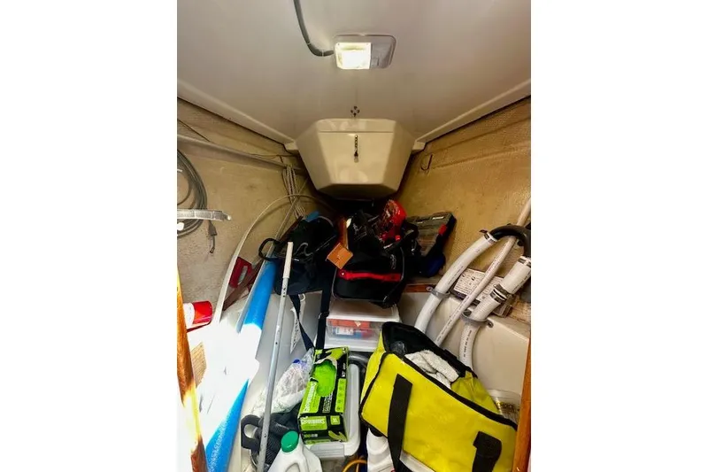 Slide: The Image of Interior of 1986 Hunter Passage 450 sailboat with storage items and equipment. - 35