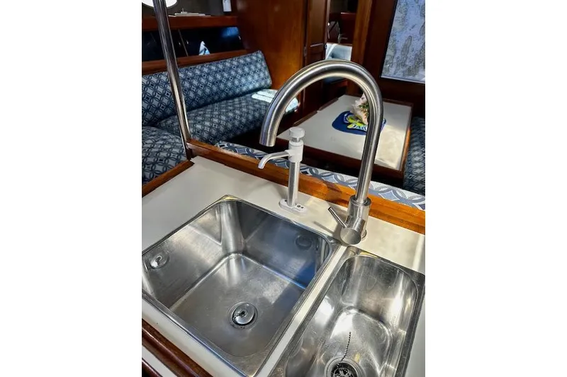 Slide: The Image of Stainless steel sink and faucet in 1986 Hunter Passage 450 yacht interior. - 43