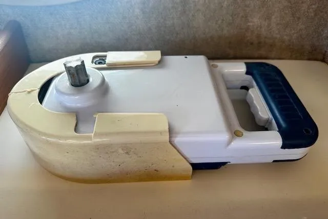 Slide: The Image of 1986 Hunter Passage 450 boat component, white and blue, with a metal gear. - 47