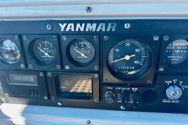 Slide: The Image of Control panel of a 1986 Hunter Passage 450 sailboat with Yanmar engine gauges. - 8