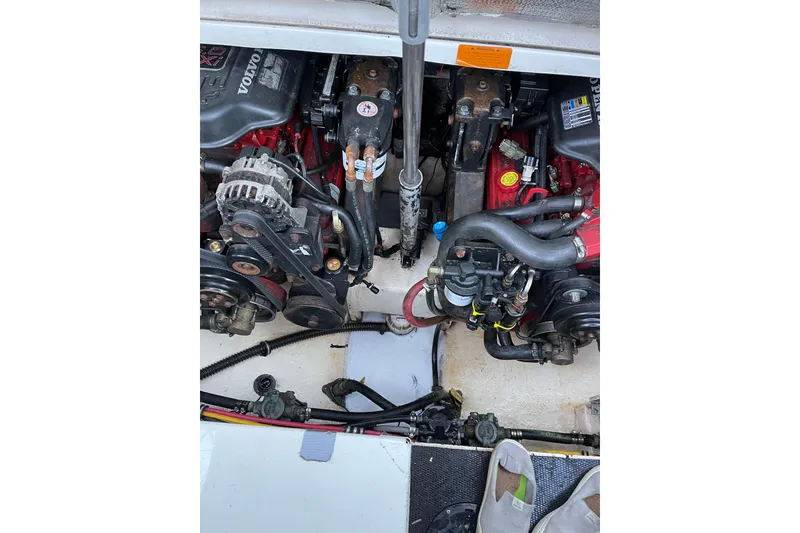 Slide: The Image of Engine compartment of a 2006 Chaparral Signature 310 boat, featuring Volvo components. - 11