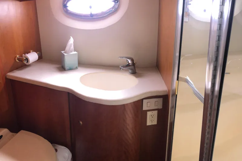 Slide: The Image of Bathroom interior of 2003 Silverton 35 Motor Yacht with sink and shower. - 12