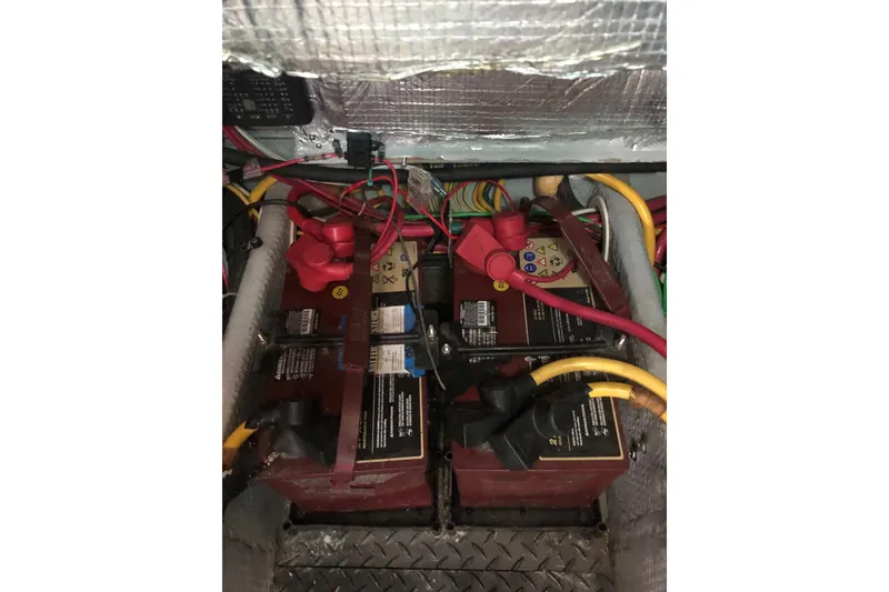 Slide: The Image of Battery compartment of 2003 Silverton 35 Motor Yacht with wiring and connections. - 15