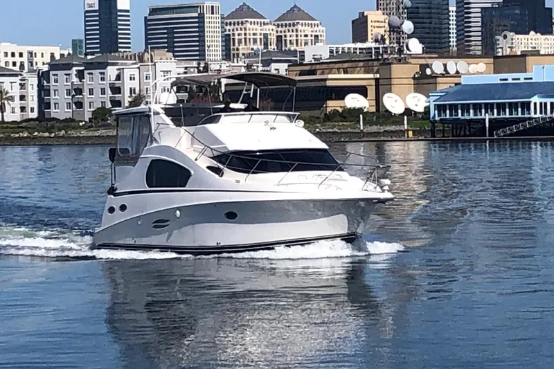 Slide: The Image of 2003 Silverton 35 Motor Yacht cruising in urban waterfront setting. - 19