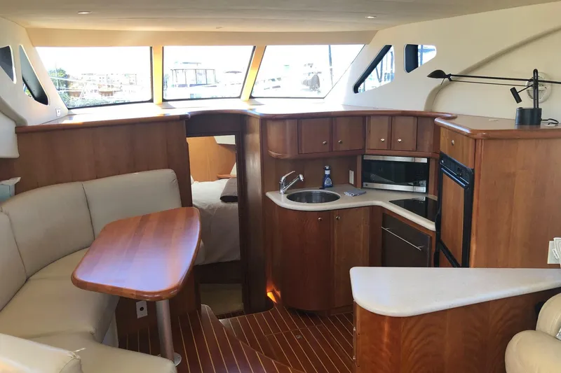 Slide: The Image of Interior of 2003 Silverton 35 Motor Yacht with kitchen and seating area. - 3