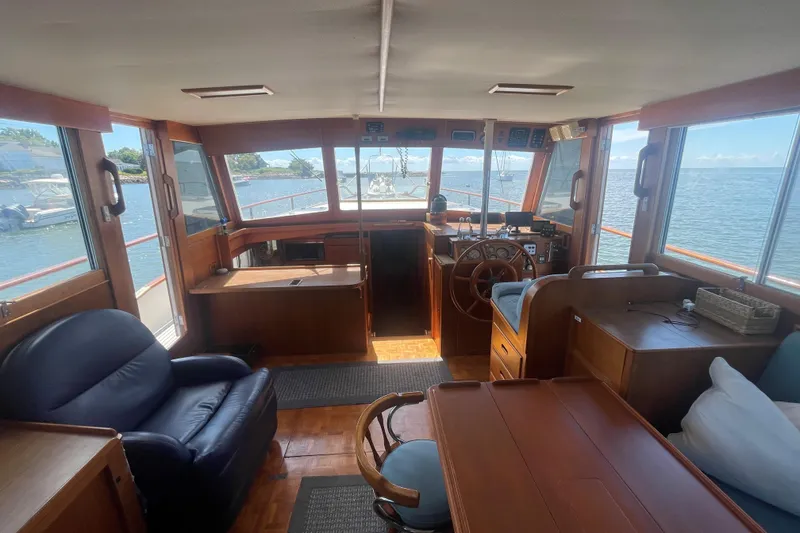 Slide: The Image of Interior of 1990 Grand Banks 46 Classic yacht with wooden furnishings and ocean view. - 11